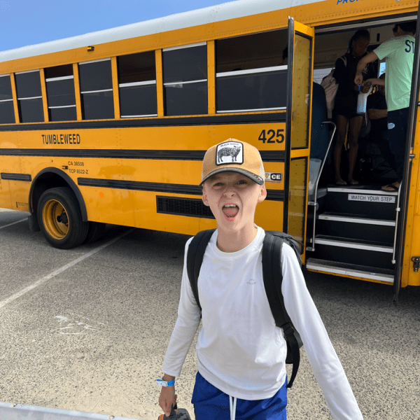 Westlake Village camper getting off the bus at Aloha Beach Camp. Aloha Beach Camp provides free transportation to and from camp every day for Westlake Village kids.