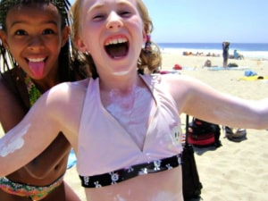 2 girls at aloha beach camp with sunscreen on